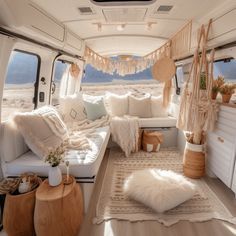 the interior of a camper van decorated in white