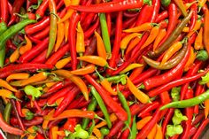 red and green peppers are in a bowl