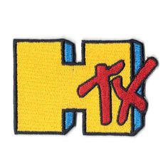 an embroidered patch with the letter k in red, yellow and blue letters on it