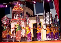 a group of people standing on top of a stage