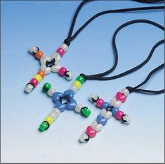 two necklaces with different colored beads on a black cord and one has a cross in the middle