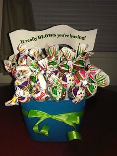 a blue bucket filled with lots of candy