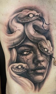 a man's chest with an image of a woman and snakes on his face