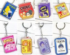 six different key chains with cartoon characters on them, all in various colors and shapes