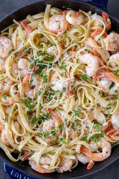 pasta with shrimp and parsley in a skillet