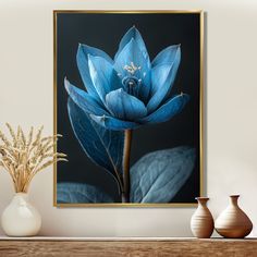 a blue flower sitting on top of a wooden table next to vases and plants