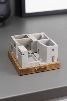 a model of a house sitting on top of a table