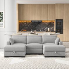 a living room with a sectional couch and marble counter top