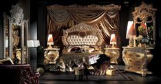 an elaborately decorated bedroom with gold furniture