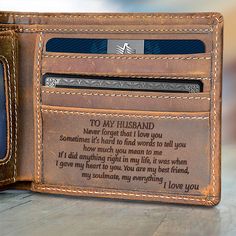 a wallet with a card slot and two credit cards in it that says to my husband never forget that i love you