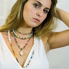 "Bright, vibrant beads make this necklace perfect addition to your summer sundress or a white blouse. African glass beads and white freshwater pearls are hand knotted along the silk cord to create a colorful and bright strand. Alone or layered with your favorites, this necklace exudes a playful, eclectic bohemian elegance. Necklace: 43\" Layer this necklace with: https://www.etsy.com/listing/637252353/baroque-pearl-and-turquoise-necklace?ref=shop_home_active_2 You might also like: https://www.et Handmade White Pearl Shell Necklace, Summer Multi-strand Colorful Beaded Necklaces, White Shell Necklace With Pearl Charm For Vacation, White Necklace For Festivals, Summer Bohemian Gemstone Beads, White Pearl Beach Jewelry, White Pearl Jewelry For Beach, White Pearl Jewelry For The Beach, Multicolor Summer Jewelry