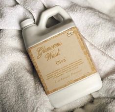 A bottle of Diva laundry wash placed on a towel, exuding an air of glamour and elegance. Diva Laundry Detergent, Tyler Candle Company, Candle Company, Candle Companies, Delicious Fruit, Fine Fabric, Laundry Detergent, Cleaning Products, Diva