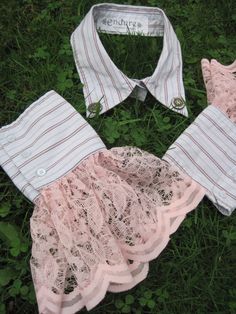 three pieces of clothing laying on the grass