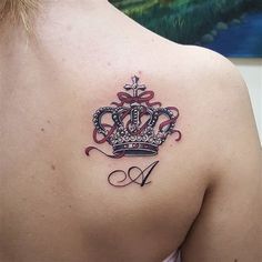 a woman with a crown tattoo on her back