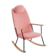 a pink rocking chair sitting on top of a white floor next to a wooden frame