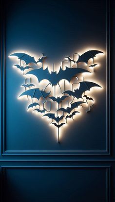 the batman symbol is lit up in blue and black with white lights on it's sides