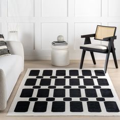 a black and white rug in a living room