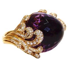 This Stunning Ring Constructed from 18kt yellow gold and adorned with diamonds and a stunning amethyst stone. this Origen maxi ring from Carrera Y Carrera will be the focus of your looks. White Diamonds 0.8ctw Cabochon Amethyst 29.81ct Retail $13,700.00 Amethyst Jewellery, Vintage Spoon Rings, Stunning Aesthetic, Butterfly Shoes, Golden Ring, Spoon Rings, Amethyst Jewelry, Women Diamond, Pretty Rings