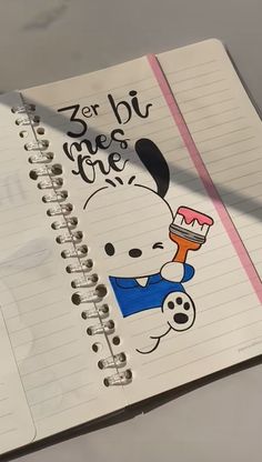 an open notebook with a cartoon character on it