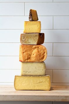 several different types of cheese stacked on top of each other