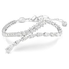 Enhance any outfit with the exquisite radiance of this Matrix bracelet. The rhodium plated design is adorned with an array of clear Swarovski Zirconia and crystals in pear and square cuts, with multiple sizes adding unexpected dimensions to the silhouette. A lobster closure ensures an easy fit. Pair this bracelet with pieces from the same family for a joyfully extravagant look. Stackable Ring Sets, Pink Watch, Swarovski Crystal Bracelet, Rose Gold Watches, White Bracelets, Hamsa Hand, Single Earring, Cuff Earrings, Metal Bracelets