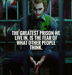 the joker is sitting in jail with his hands on his knees and an inscription that reads,