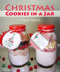 two christmas cookies in a jar with labels on them