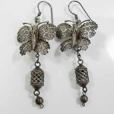 This lovely pair of vintage sterling filigree butterfly earrings are representative of butterfly dreams. The transformation of a butterfly from egg, chrysalis and finally a butterfly are part of its metamorphosis. These are suspended from sterling hooks for pierced ears. They complement my other listing for a butterfly dreams necklace. They measure 2 ½ x 1 inch is size and are very lightweight at 4 grams each. It will arrive gift boxed for you to enjoy! Join me and celebrate the re-creation of antique and vintage jewelry repurposed and reborn at Vintage Delights Too.  I hope you've enjoyed looking at my creations. They are so much fun to create! All of my jewelry is created and assembled with vintage and salvaged components. Most of the findings such as clasps are new to keep the jewelry s Assemblage Earrings, Vintage Jewelry Repurposed, Aging Metal, Filigree Earrings, Butterfly Earrings, A Butterfly, Looks Vintage, Pierced Ears, Assemblage