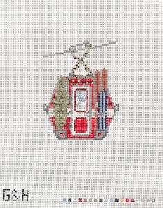 a cross stitch pattern with an image of a helicopter