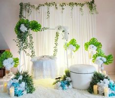 a wedding ceremony setup with flowers and greenery