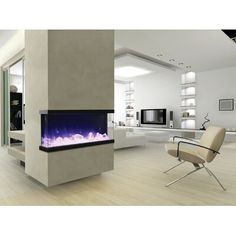 a modern living room with a fireplace in the center