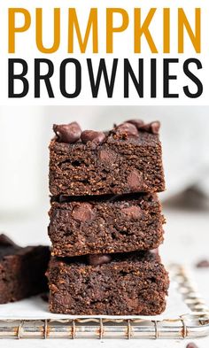 pumpkin brownies stacked on top of each other with chocolate chips in the middle and text overlay