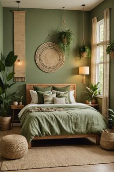 a bedroom with green walls and lots of plants on the headboard, along with a large bed