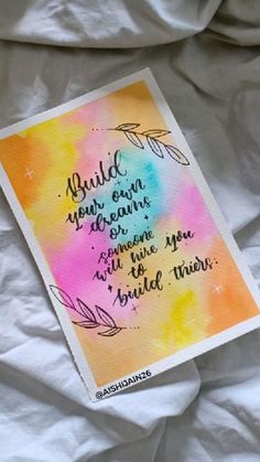 a watercolor card with the words build your own dreams and some type of true love