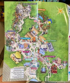 a map of the park and its attractions is shown on an iphone screen, with information about it