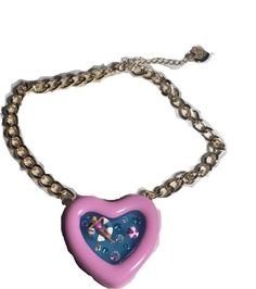 TRENDY NECKLACES : The Chain necklace featuring colorful pink heart-shaped pool pendant adorned with playful Betsey babe and minimal stones. LIGHTWEIGHT NECKLACES : Lightweight necklace easy to put on and take off.  Necklace has an adjustable lobster clasp closure. MEASUREMENTS : 16" + 3" Extender (L), Pendant Drop: 2.4" PERFECT FOR GIFTING : Wonderful gift for all year-round . HYPOALLERGENIC JEWELRY: Made with nickel and lead free metal that is less likely to cause any allergic reaction.  Additional materials include glass crystal. All sells are final! Multicolor Party Necklaces For Valentine's Day, Trendy Heart Choker Necklace For Valentine's Day, Cute Pink Clavicle Chain Jewelry, Multicolor Heart Charm Necklace For Party, Party Heart Choker Necklace With Clavicle Chain, Cute Party Jewelry With Heart Charm, Cute Heart Charm Jewelry For Parties, Trendy Party Heart Choker Necklace, Cute Heart Charm Party Jewelry