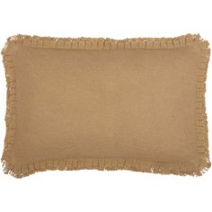 a tan pillow with fringe trim