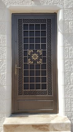 a door with an intricate design on the front and side of it, in stone