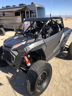 an off road vehicle parked in the desert