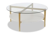 a round glass table with gold legs and a white plate on the bottom that has an x design