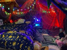 a bed covered in lots of colorful lights