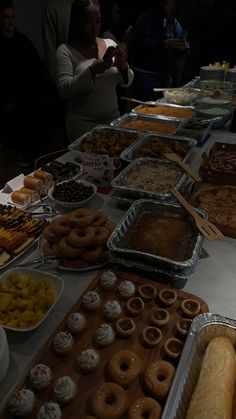 a buffet table filled with lots of different types of food