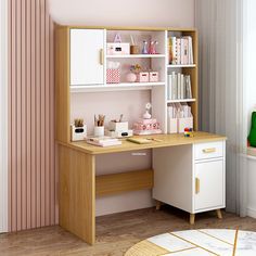 a wooden desk topped with lots of books and office supplies next to a pink wall