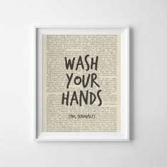 a framed book page with the words wash your hands in black ink on top of it