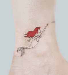 the little mermaid tattoo on the ankle is very cute and it looks like she's floating