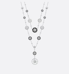 a long necklace with black and white charms