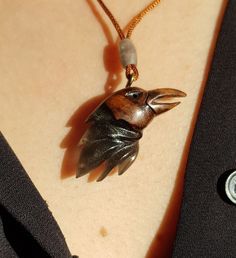 This is a 100% handmade Resin & Stabilized Wooden necklace. I'm proud to have this handmade necklace in my shop. This Raven Bird pendant will make a perfect unique gift for Christmas, i will send it in a nice giftbox. This necklace is made of Resin & Stabilized Wood and completely handcrafted. Every detail is carefully handcarved. Cord is adjustable Ready and packed for shipping, what you see is exactly what you get. Please contact me for custom order. Unique Carved Brown Necklace, Unique Brown Carved Necklace, Carved Pendant Necklace Collectible, Collectible Carved Pendant Necklace, Unique Bird Design Pendant Jewelry, Brown Carved Round Pendant Necklace, Artisan Jewelry With Lobster Clasp As Gift, Artisan Jewelry With Lobster Clasp For Gift, Brown Spiritual Personalized Jewelry