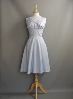 This beautiful vintage inspired summer dress is made from a medium weight 100% linen in a pale lavender blue. The curved sweetheart neckline and nipped in waist make it a very flattering style and the flared half-circle skirt can be emphasized with a  petticoat (as pictured - petticoat not included) to create the full 1950s silhouette or left to fall naturally for a more casual look.  This dress is the last available in this particular shade of linen and is ready made and available off-the-peg i Fitted Sleeveless Linen Dress For Garden Party, Sleeveless Fitted Linen Dress For Garden Party, Lace Bolero Jacket, Dig For Victory, Silver Glitter Heels, Dress Lavender, Lace Bolero, Pale Lavender, Glamorous Dresses