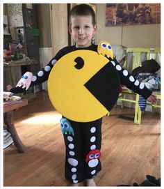 a young boy is dressed up as pacman