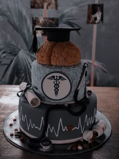 a cake with a medical theme on it and a stethoscope in the middle